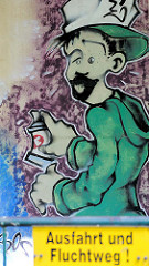 Graffiti an einer Hauswand - Sprayer in Gardelegen; Schild Ausfahrt und Fluchtweg.