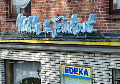 Ladenschild Milch & Feinkost, Geschäft in Hamburg Kirchwerder.