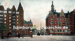 Blick über die St. Annenbrücke zur Kornhausbrücke - im Hintergrund ist der Kirchturm der St. Petrikirche zu erkennen. Links steht ein Pferd mit Decke in seiner Deichsel, zwei kleine Strassenbäume sind an den Strassenrand gepflanzt.