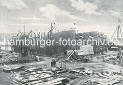 Schiffsbau auf der Werft Blohm & Voss; zwei Schiffsrümpfe liegen auf Kiel - eines ist bereit für den Stapellauf.