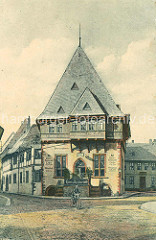 Historische Ansichten aus Goslar - Gildehaus von 1657; Hotel Restaurant Cafe - Mann auf einem Fahrrad / Fahrradfahrer.