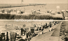 Alt Duhnen an der Nordsee - Strand mit Badegästen / Strandkörben; Badebrücke mit Restaurant.