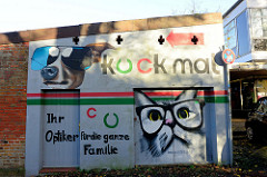 Wandbild  / Fassadenmalerei  - Werbung eines Optikers in Bad Segeberg.