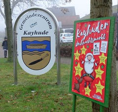 Ankündigungsplakat für den Kayhuder  Weihnachtsmarkt - Gemeindezentrum mit Wappen.