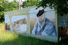 Das Ostseebad   Graal-Müritz   ist eine Gemeinde   im Landkreis Rostock in Mecklenburg-Vorpommern; Wandmalerei - Trafo in Müritz, Fischer mit Bart und Reetdachhaus.